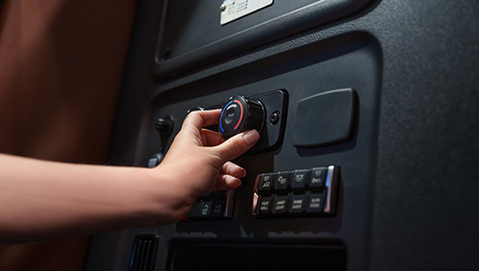 Digital key ignition system in commercial truck dashboard with terracotta interior trim